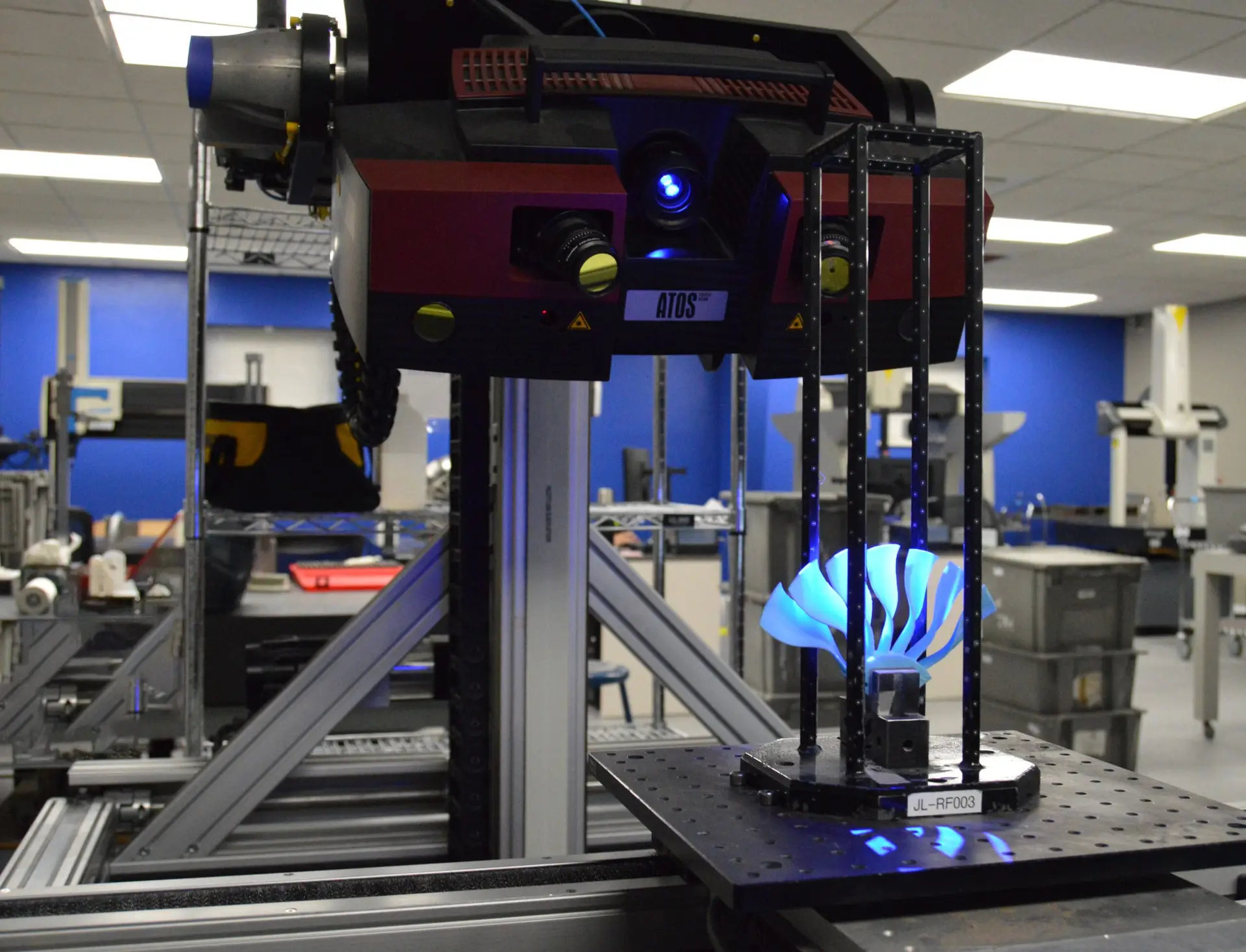 ATOS blue light 3D scanner inspecting a turbine component on a CMM table