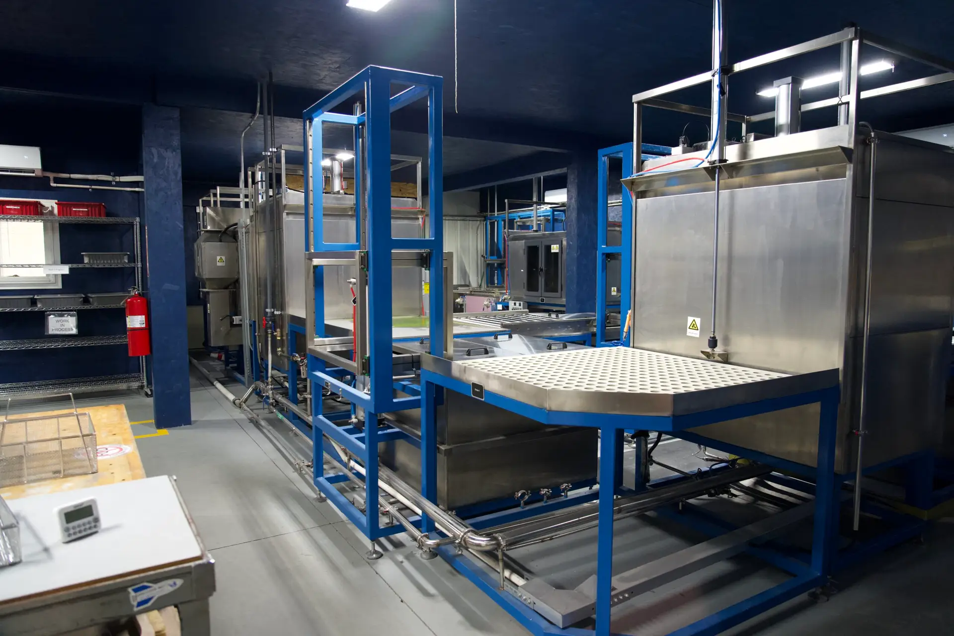 Fluorescent penetrant inspection line for nondestructive testing at J&L Dimensional Services.
